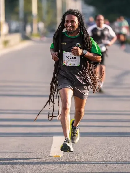 Running with style and spirit. This participant's unique look adds to the vibrant and diverse atmosphere of our community running events.