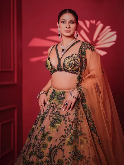 A full-length view of the intricately embroidered lehenga. The unique color combination and modern blouse design make this a standout piece for any grand occasion.
