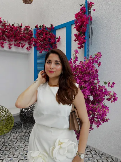 Another look at this elegant white dress. The simple silhouette is elevated by the 3D floral details, making it a perfect brunch or day-event outfit.