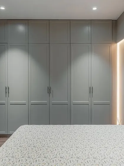 Timeless elegance is at the heart of our work. This classic wardrobe, finished in a warm, earthy-toned Italian lacquer with subtle routing patterns, brings a quiet sophistication to the bedroom. The antique finished handles complete the look, creating a piece that feels seamlessly integrated and built to last.