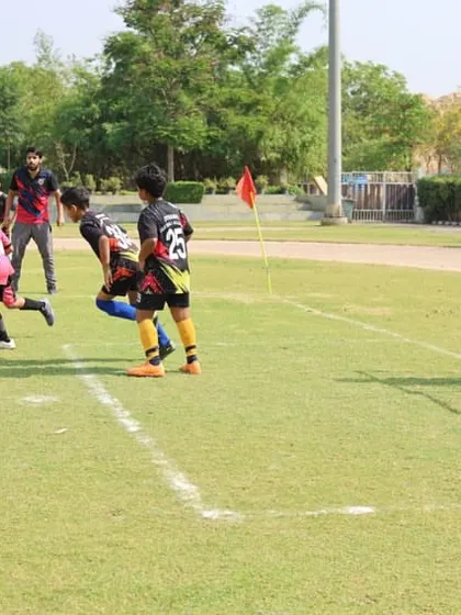 An intense moment during a match, with players converging on the ball.