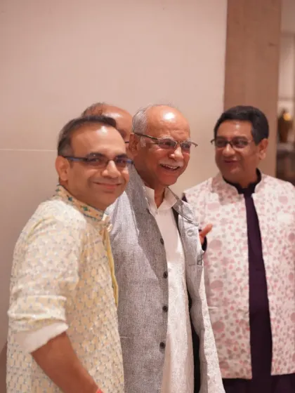A candid moment of laughter and conversation among guests. These photos capture the warm and lively atmosphere of the celebration.