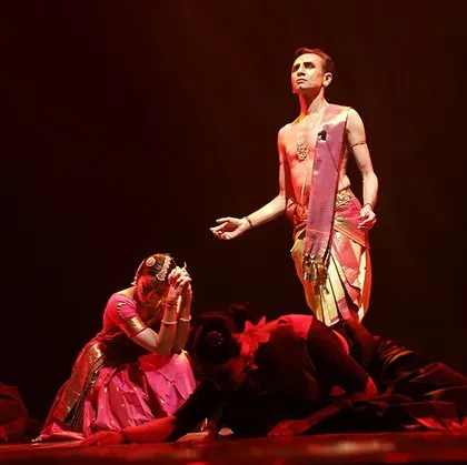 A scene of reverence and emotion from "Ṛtu Vismruthi." The composition of dancers on stage creates a powerful visual narrative about our relationship with nature.