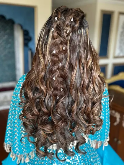 A close-up of the intricate braids in this half-up style.