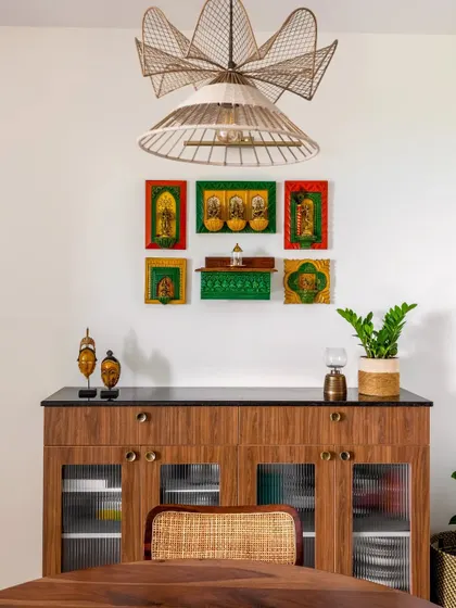 Another angle of the combined puja and crockery unit, with a modern wicker pendant light overhead. This demonstrates how I blend different styles to create a harmonious look.
