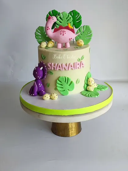 The vibrant colors and friendly characters make this dinosaur cake a huge hit at kids' parties.