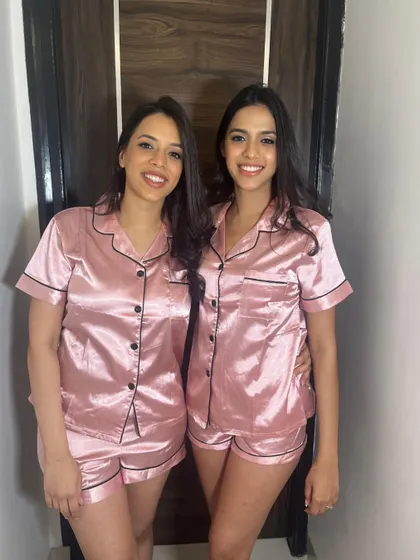 Getting ready together! Two bridesmaids in their matching pajamas, with fresh, natural makeup to start the day.