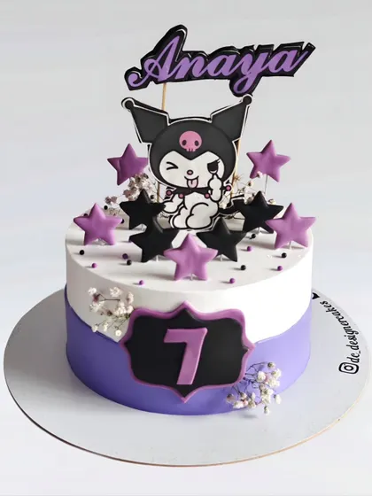 A Kuromi-themed cake for a 7th birthday. This design captures the mischievous but cute character from the Sanrio universe with a purple and black color scheme.