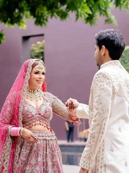 The couple sharing a dance, with the bride's beautiful lehenga on full display.