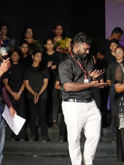 Sharing a laugh on stage. My approach to event choreography is always light-hearted and fun. We work hard, but we also make sure to enjoy every moment of the process.