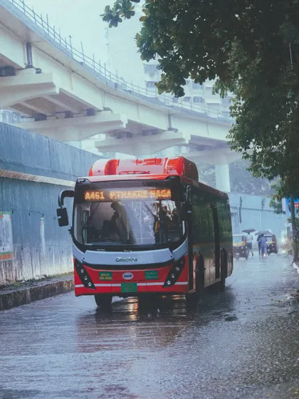 A moody shot of a red bus in Powai during the monsoon. The rain and fog create a calm yet wild atmosphere that I love to capture in my films.