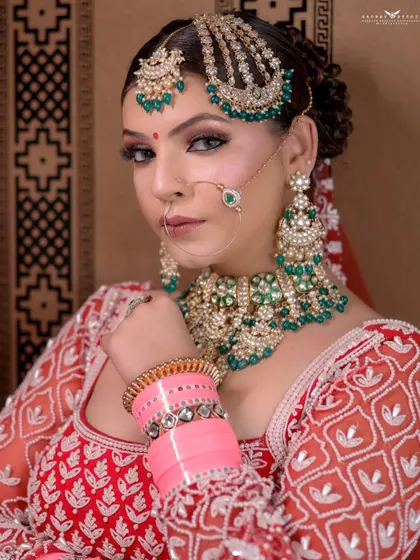Another beautiful close-up, this time with a direct and engaging look. The focus is on the stunning details of her matha patti, nath, and necklace.