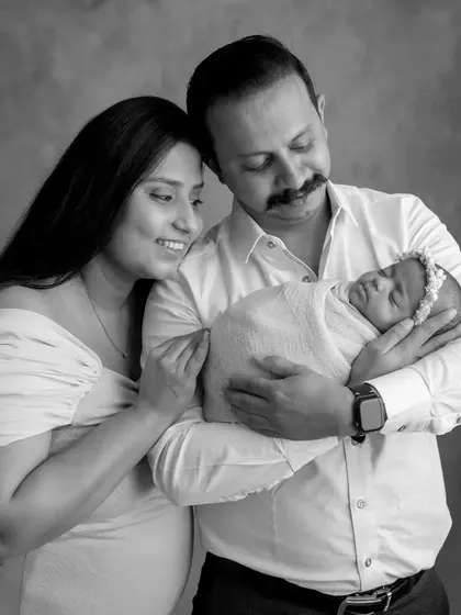 A classic family pose that looks elegant and timeless in a monochrome edit.