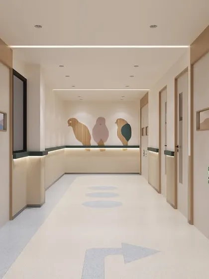 This is a corridor in a pediatric ICU, where we introduced playful, bird-shaped wooden cutouts and soft, rounded corners. These whimsical details help to reduce fear and anxiety for young patients and their families in a high-stress environment.
