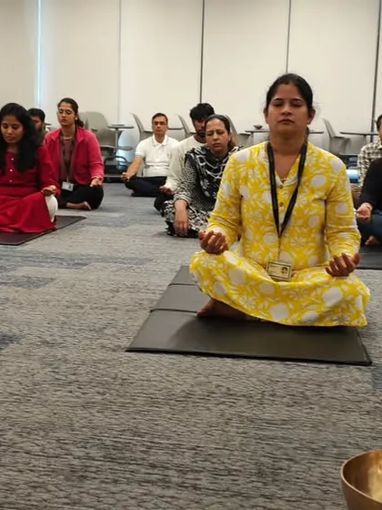 A group of employees from Hewlett Packard Enterprise meditating peacefully on their mats during a sound healing and breathwork session.