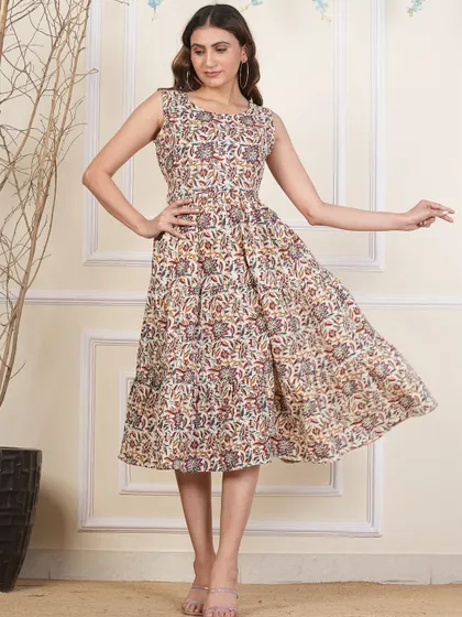 Another view of the neutral-toned tiered dress, highlighting the beautiful details of the hand-block print.