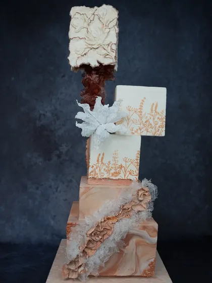 A preview of our "Art of Tiered Elegance" workshop, featuring a modern, multi-shaped structural cake. This class focuses on advanced techniques like internal supports, weight balancing, and achieving sharp edges on unconventional shapes.