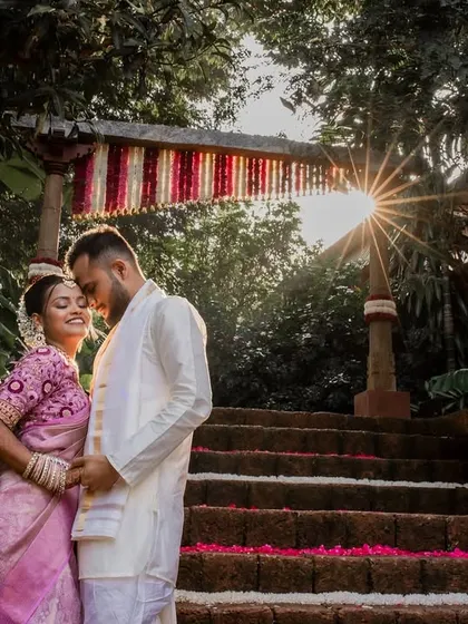 A bride basking in the golden hour glow. We chase beautiful light to create artistic portraits like this one of Aishwarya, capturing her radiance and joy as she steps into a new beginning at The Peacock Grove.