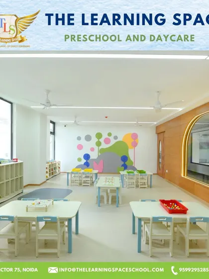 Another view of one of our spacious classrooms, featuring colorful wall murals and neatly arranged learning centers that invite children to explore.