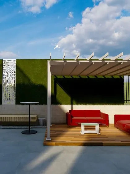 A minimalist and modern terrace design. This space features a clean, open layout with a simple white pergola over a wooden deck, furnished with a bold red sofa that adds a pop of color against the green wall backdrop.