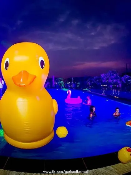 The GETLOUD Pool Party experience, complete with giant inflatable ducks and a sunset backdrop. It's all about fun in the sun.