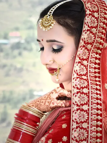 A classic bridal portrait with the mountains in the background, perfectly blending the bride's beauty with the beauty of Himachal.