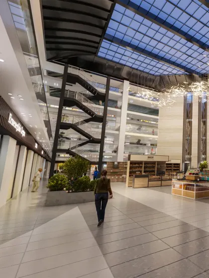 In our commercial projects, we focus on creating immersive experiences. This view of an upcoming mall shows how we use multi-level sightlines, a soaring glass ceiling, and sculptural elements to design a retail environment that encourages exploration and connection.