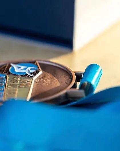 A close-up of the World Cup bronze medal from Villars. Each one represents countless hours of training, dedication, and the support of our amazing community.