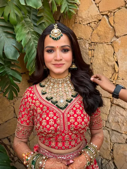 A beautiful candid shot of the bride getting ready. The makeup is soft and glowing, with a focus on enhancing her natural features.