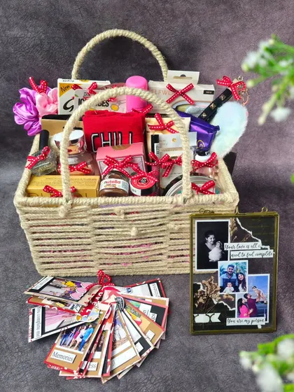 A wider shot of the indulgent hamper, showcasing the woven basket and the sheer volume of thoughtful gifts packed inside.