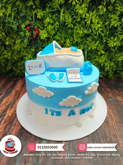 Another adorable "It's a Boy" baby shower cake. The design with a baby in a cradle and tiny shoes is a sweet way to celebrate the new arrival.