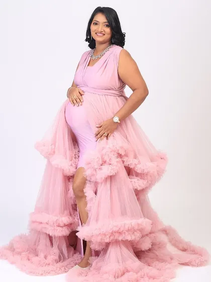 A beautiful maternity shoot. We went for a soft glam look to enhance her radiant pregnancy glow. She looks absolutely stunning in this pink ruffled gown.