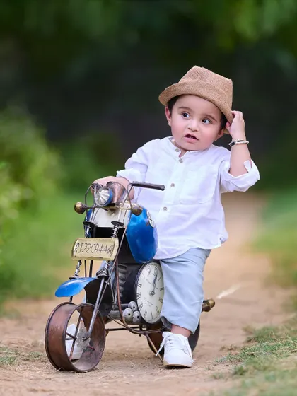 A thoughtful moment from this stylish little rider. Even the quiet, candid shots during a themed session can beautifully capture your child's personality.