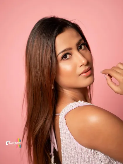 This portrait of Niviksha captures a moment of quiet elegance, with a focus on her profile and the beautiful designer outfit.
