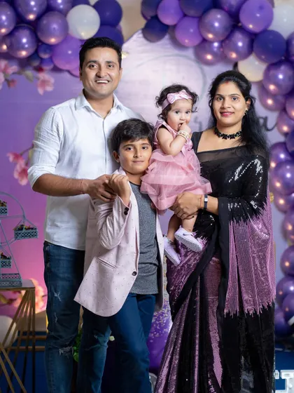 A beautiful family portrait from a first birthday celebration.