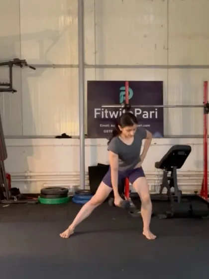 A side lunge with a dumbbell. This move is excellent for building strength and flexibility in the inner and outer thighs.