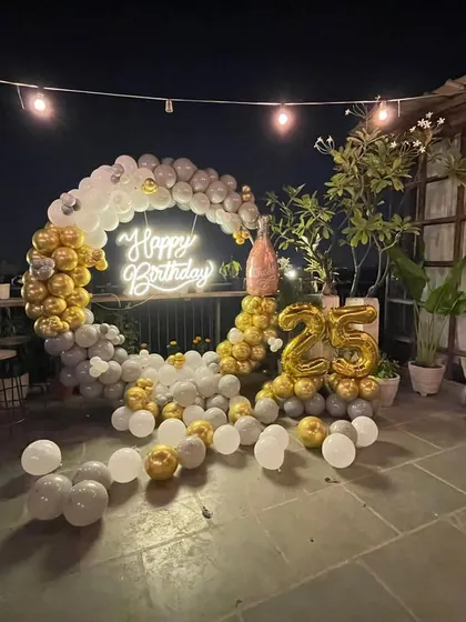 A wide shot of the 25th birthday terrace party decor, showing how the elements come together to create a beautiful and celebratory atmosphere.
