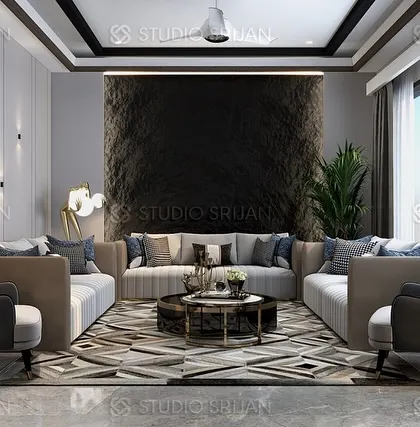 A drawing room in Sushant Lok, featuring a sophisticated color palette of greys and blues, with a textured accent wall and a geometric-patterned rug.
