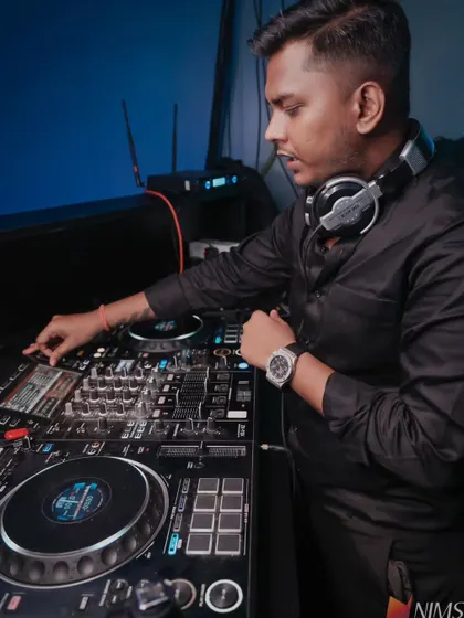 A side profile shot showing my concentration as I line up the next song on the CDJ.