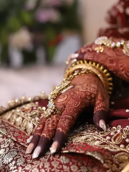 Another beautiful shot of the bridal stain, showing how it complements the traditional wedding attire.