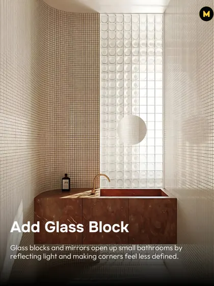 To make a small bathroom feel bigger, add glass blocks and mirrors. They open up the space by reflecting light and making the corners feel less defined, as seen in this curved bathroom design.