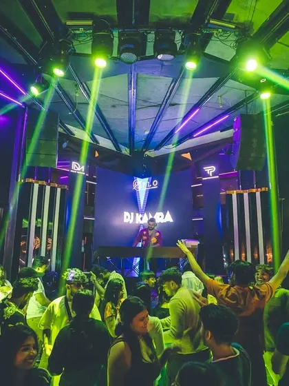 A wide shot of the club, with me on stage and the crowd going wild. This is the Kamra effect.