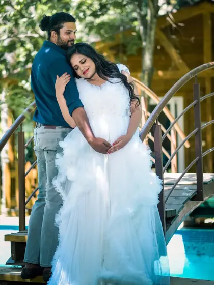 Another shot from the rustic cabin maternity shoot. The white gown provides a beautiful contrast against the wooden bridge and natural surroundings.