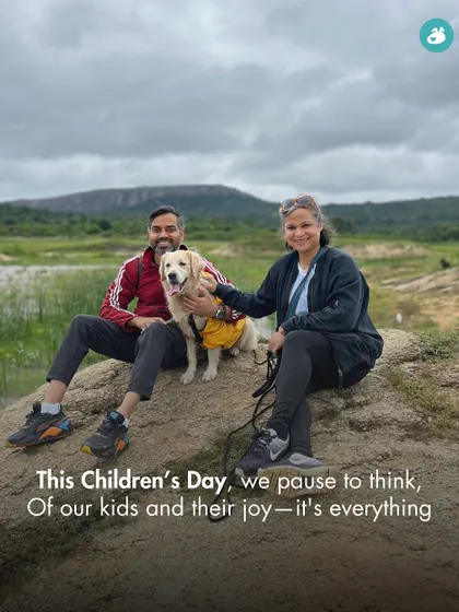 A couple enjoying a hike with their dog. On Children's Day and every day, we celebrate the joy our furry kids bring into our lives.