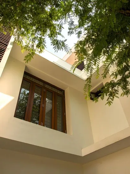 Looking up from the courtyard, this view shows how the architectural forms create interesting compositions with the sky and surrounding trees.