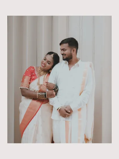 The bride leaning on the groom's shoulder, a sweet and intimate moment between the newly married couple.