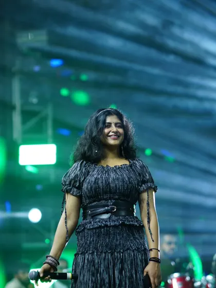 A smile for the audience during a performance. Connecting with the crowd is what makes a live show so magical.