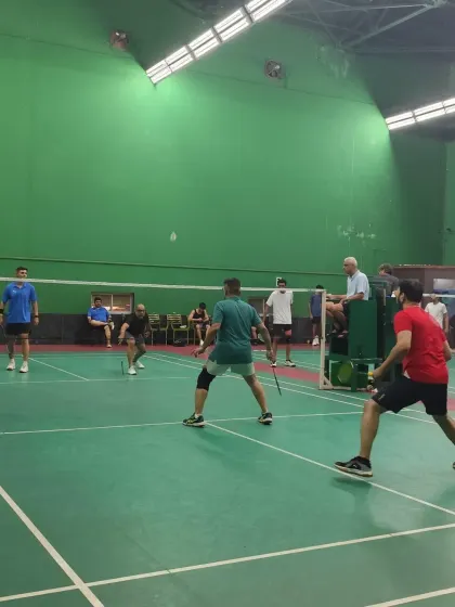 Players in ready position during a tense moment in a friendly match. The competitive spirit is always alive.