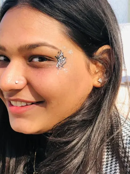 A small, silver-glitter butterfly that adds just the right amount of sparkle.