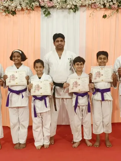 These students have all earned their purple belts, a significant achievement. Their hard work at the Rejoice International School program is evident.